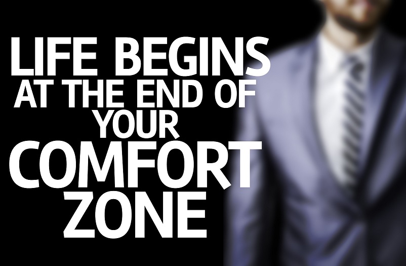 Life Begins at the end of Your Comfort Zone written on a board w